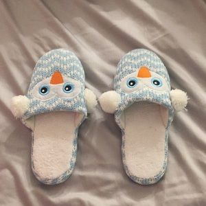 I am selling knitted owl slippers.